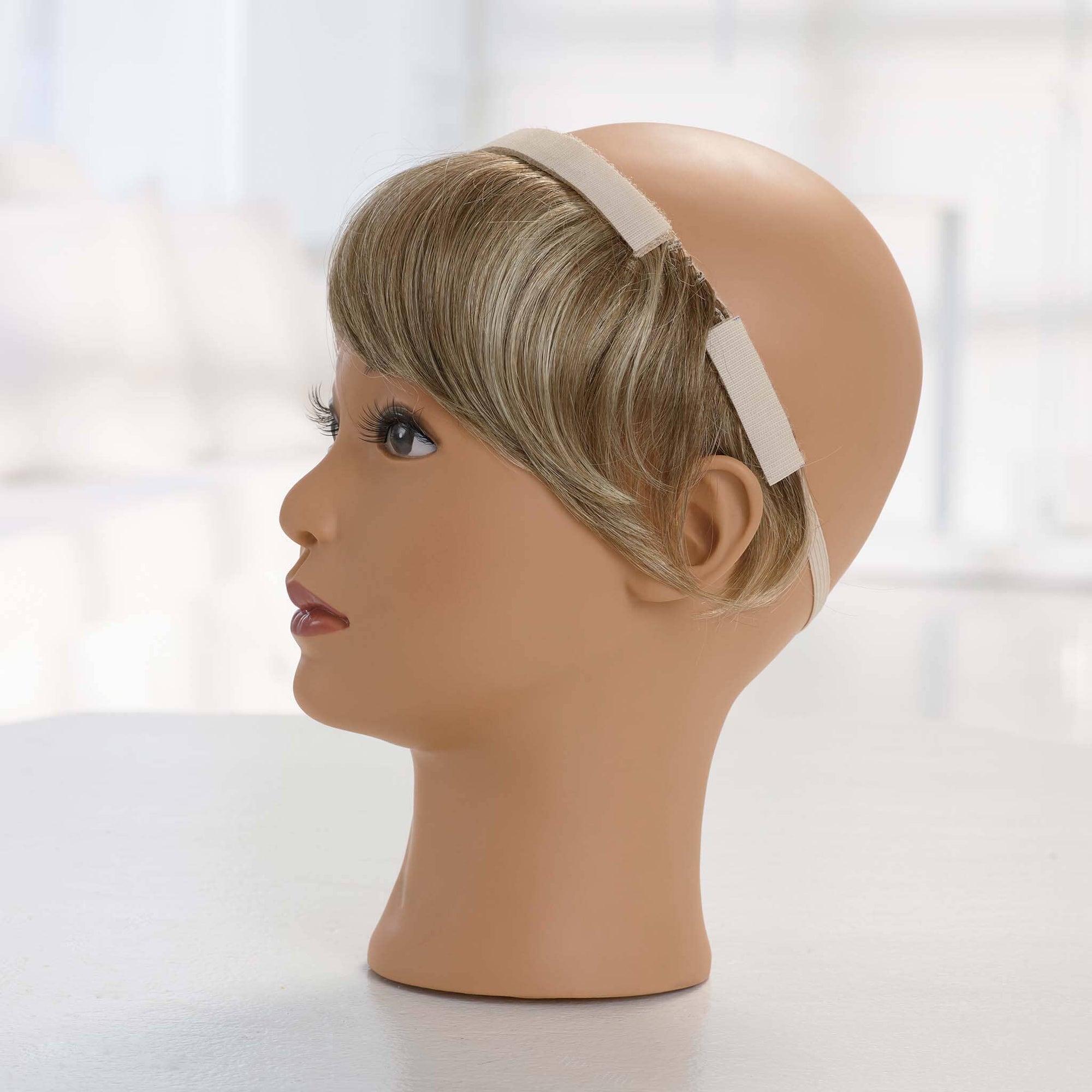 Add-a-Bangs can also be worn straight in the back.