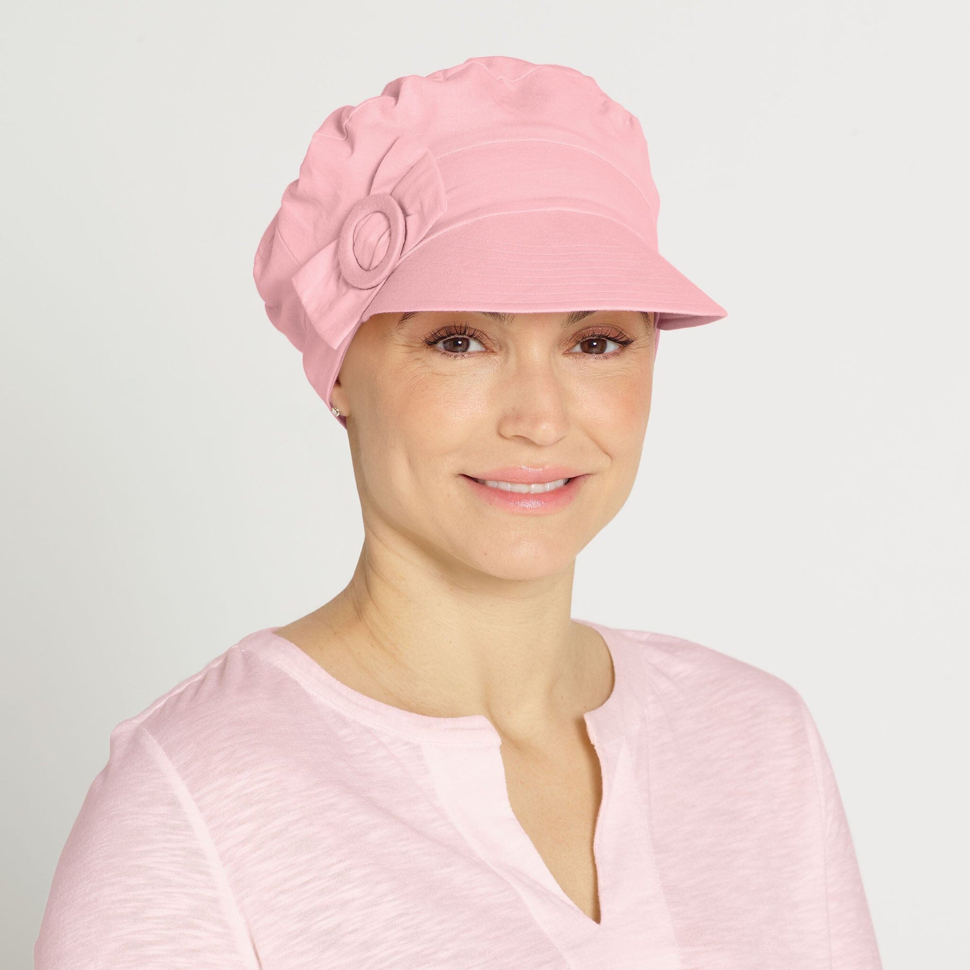 #7642 Stretchy Soft Cotton Knit Newsboy Cap shown in pink.